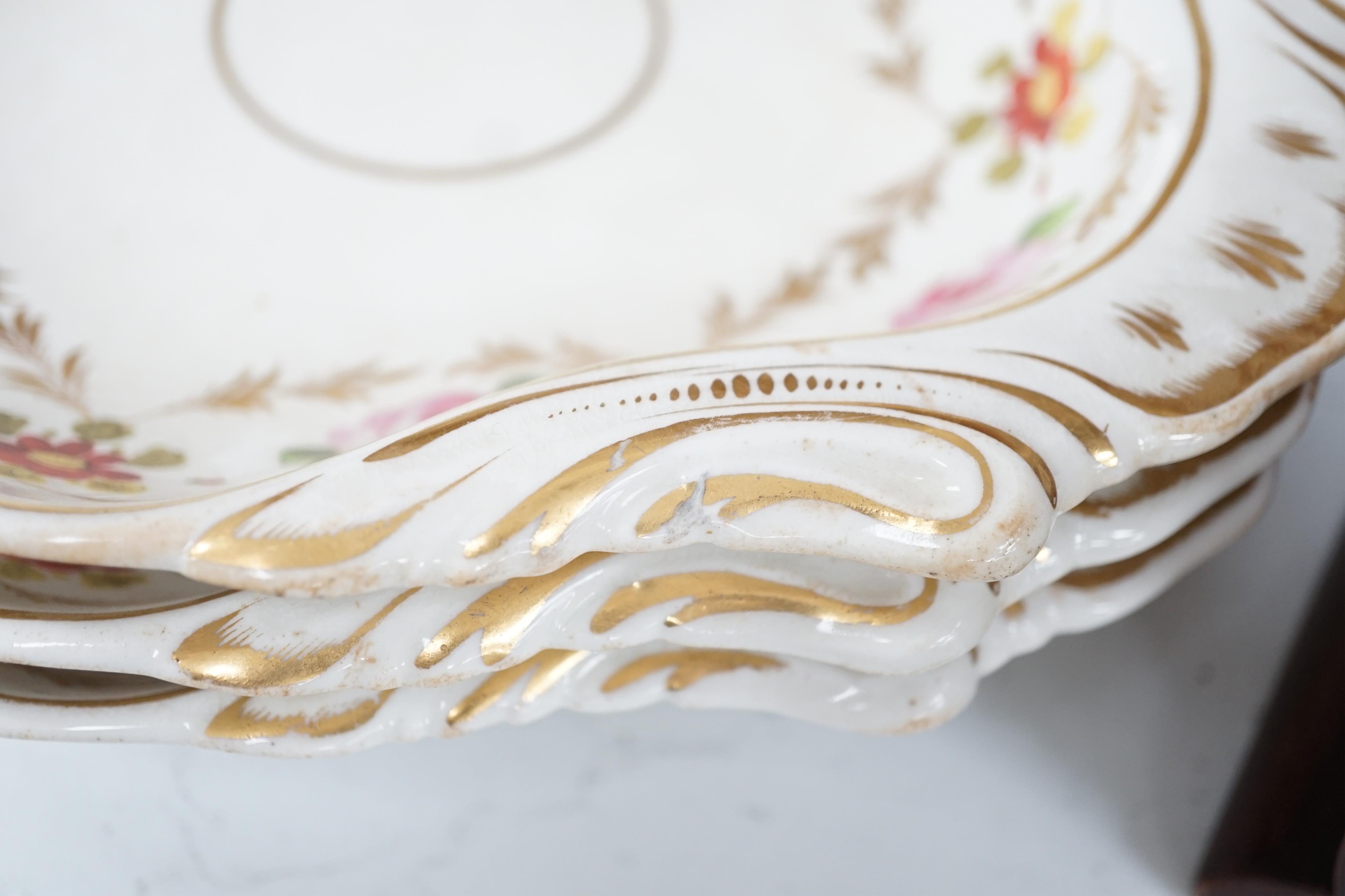 A sixteen piece Derby porcelain part dessert service, the borders painted with roses. Condition - some dishes and plates damaged or stained or crazed.